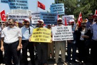 Civil servants stage a protest outside the Foreign Ministry in Ankara, Turkey, on July 17, demanding the release of 49 officials seized by Islamic militants in June at the Turkish consulate in Mosul, Iraq