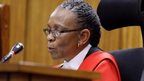 Judge Masipa reads her verdict during the trial of Olympic and Paralympic track star Pistorius at the North Gauteng High Court in Pretoria