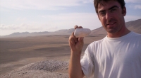 Matthieu Carré holds a 6,800-year-old mollusk collected from a site in Peru’s Ica valley. 
