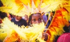 ‘A little performer in costume takes part on the first day of the Notting Hill carnival in west London on August 24, 2014.’
