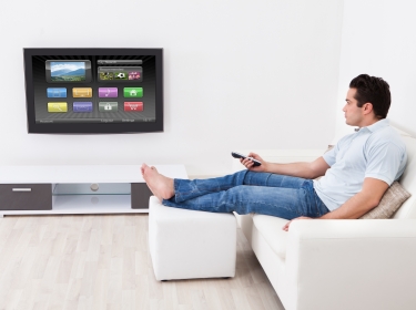 Man in living room with smart television