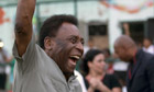 Pele pumps his fist in the air 