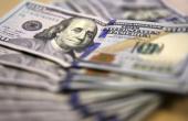 Dollar's Rise Pressures Commodities Amid Fed Anxiety