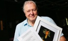 Sir David Attenborough with a photograph of the "prethopalpus attenboroughi" spider at the museum of Western Australia in Perth on Saturday, Aug. 4, 2012.
