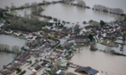 Flooded propeties are seen as water surrounds the village of Moorland on the Somerset Levels near Bridgwater on February 10, 2014 in Somerset, England.