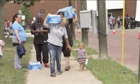 On Sunday, residents in Toledo Ohio carry water 