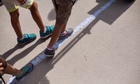 Kids chalking 6ft sea level rise line for HighWaterLine, Biscayne Blvd, Miami, FL