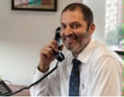 Date: 09/2014 Description: Josh Glazeroff, the Bureau of Consular Affairs' Office of Fraud Prevention Programs' director, takes a phone call. - State Dept Image