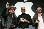 Members of the music group U2, including Bono, left, at an Apple event in 2004 with Steven P. Jobs. The group is expected to play a role in Apple's announcements this week.
