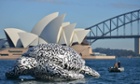 A five-metre tall sea turtle is towed around Sydney Harbour