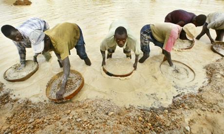 Miners pan for diamonds near Koidu in northeastern Sierra Leone.