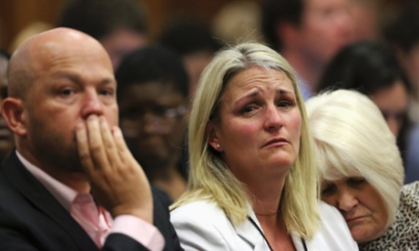 Family members of Reeva Steenkamp react as they listen to the verdict that Oscar Pistorius is guilty of culpable homicide.