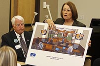 : Cynthia Hall, UNT System director of system and external relations, shows an architect's rendering of a moot court in the future law school building to pre-law students from the University of North Texas at Dallas Nov. 5.