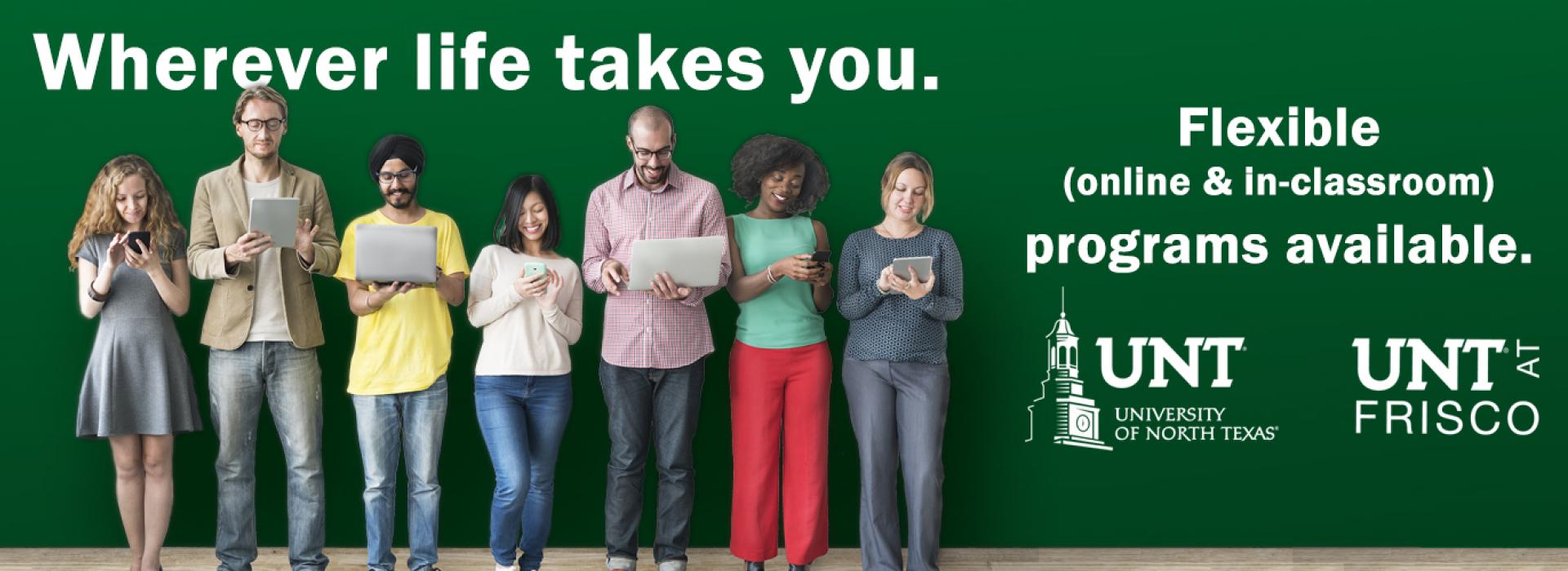 a group of male and female students of different ethnicity on digital devices