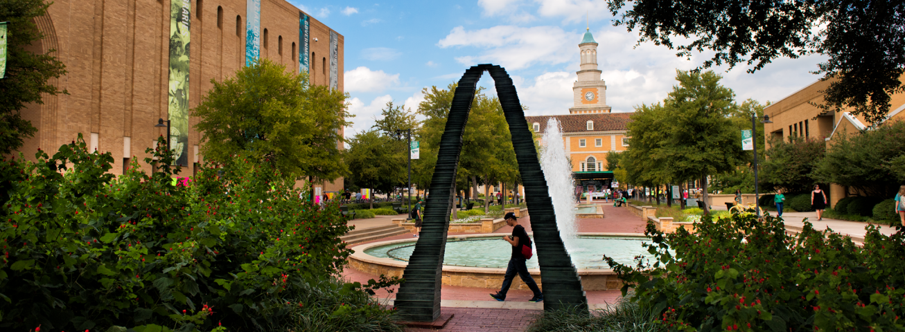 Arch and fountain in front of the Library at the UNT main campus