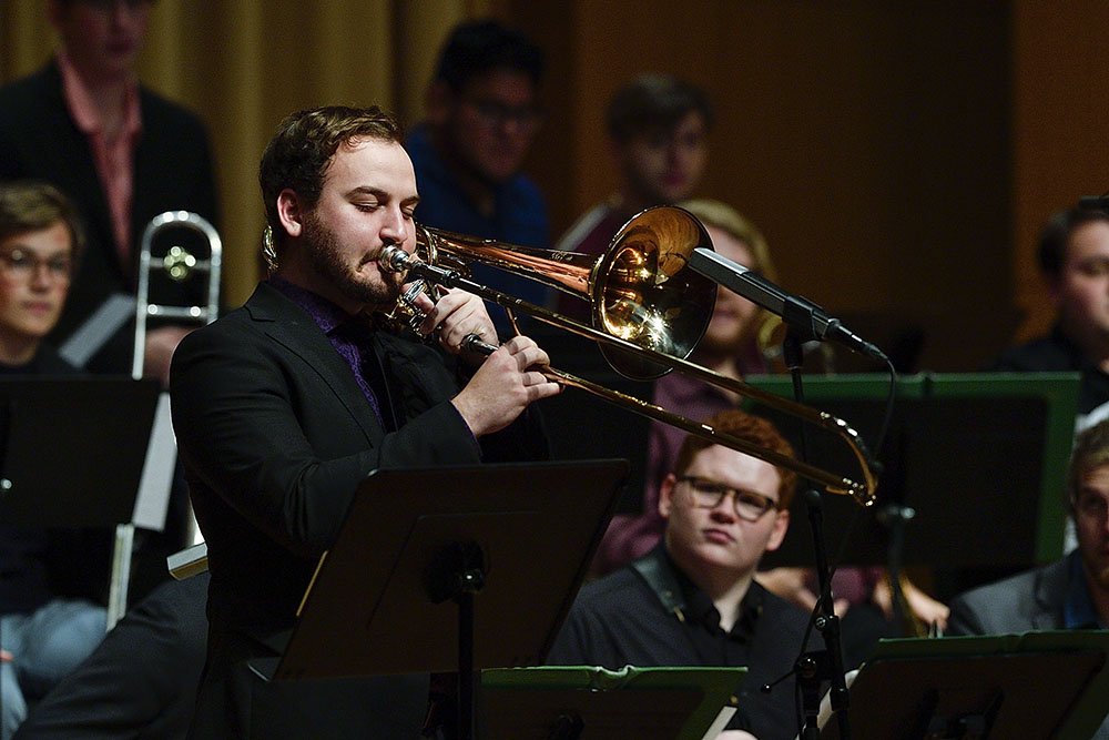 Photo of guy playing trombone during UNT Trombone Day.