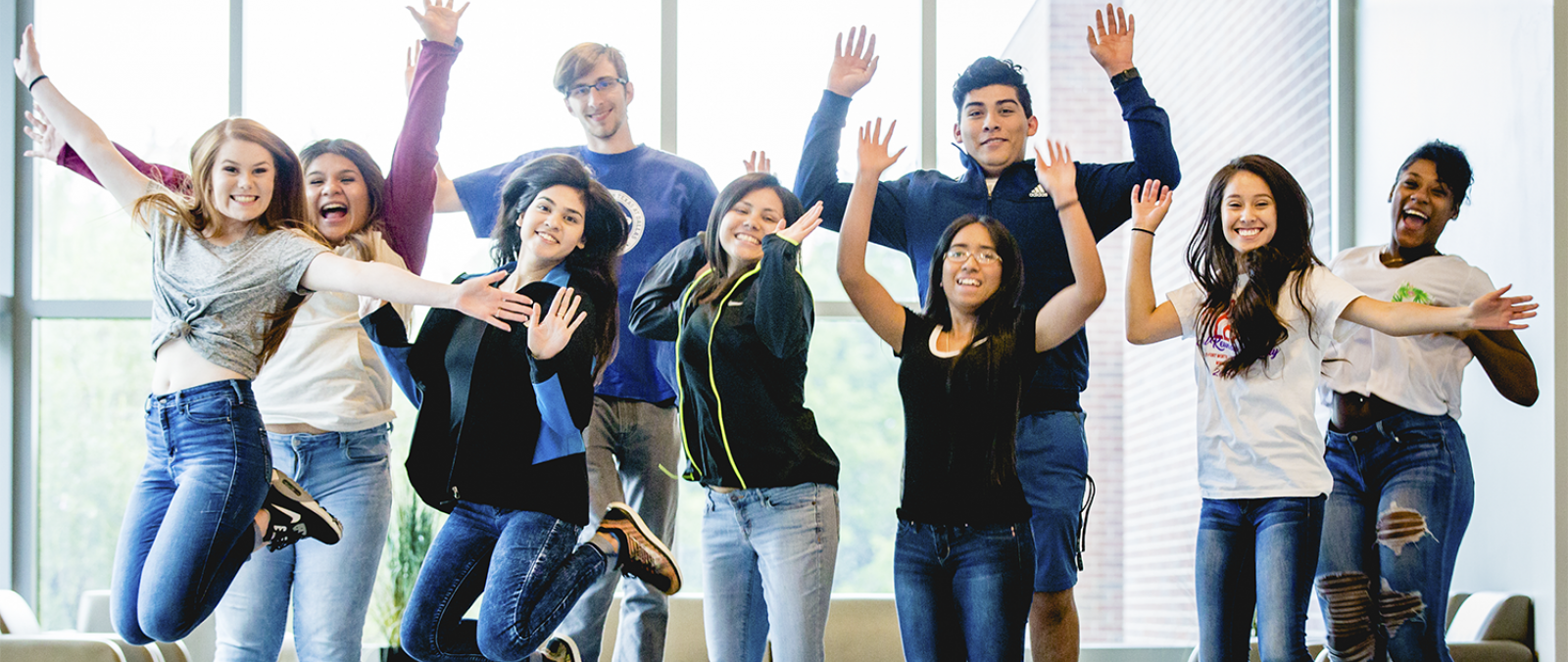 Freshman class of presidential scholars leaping in the air