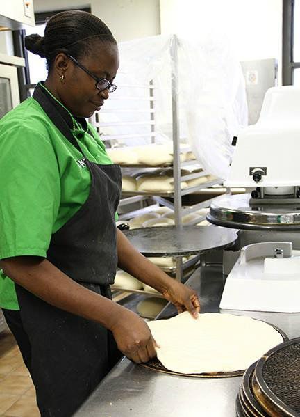 Employee Making Pizza