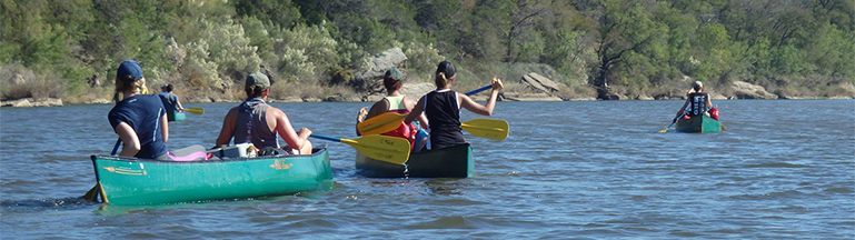 trip participants canoeing the brazos river