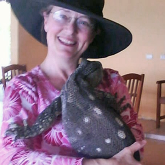 Rebecca Cagle holding a monitor lizard