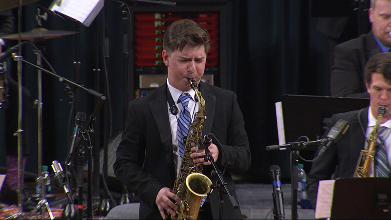 Kyle Myers performing on saxophone