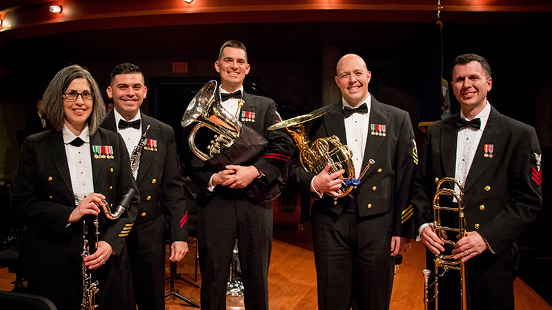 UNT Navy Band Alumni standing with instruments