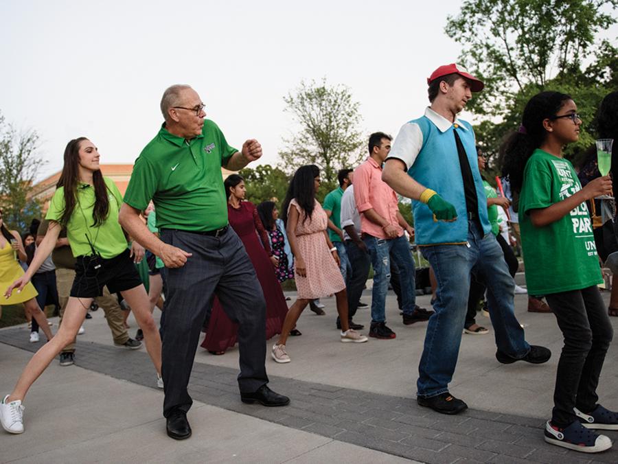 <p>UNT President Neal Smatesk particaptes in a dance at the 2018 Grad Block Party</p>
