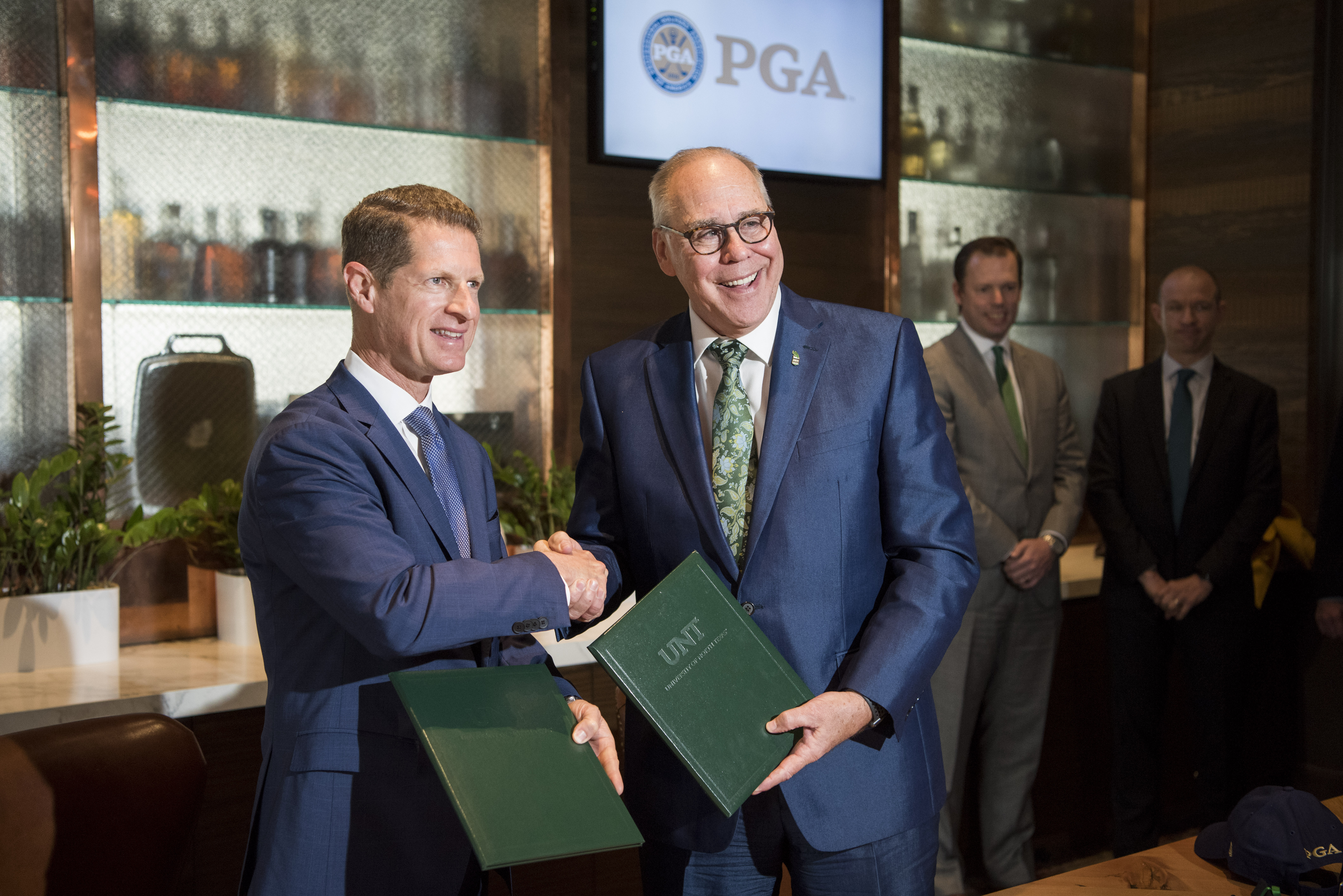 PGA Chief Operating Officer Darrell Crall and UNT President Neal Smatresk