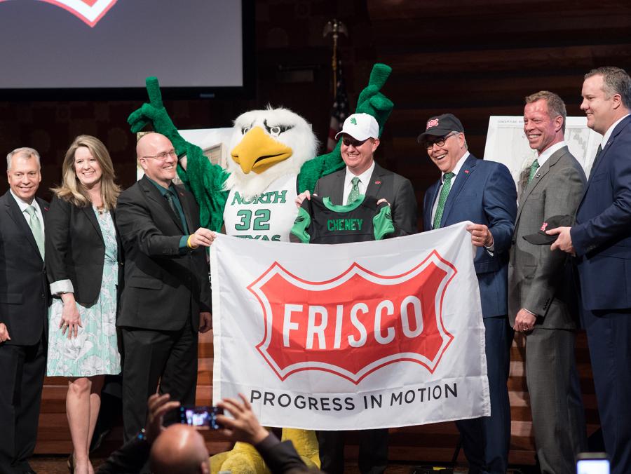 <p>Pictured at left, from left to right: Frisco City Councilman Will Sowell, Frisco Mayor Pro Tem Shona Huffman, Frisco City Councilman Bill Woodard, Scrappy, Frisco Mayor Jeff Cheney, UNT President Neal Smatresk, Frisco Deputy Mayor Pro Tem John Keating and</p>
