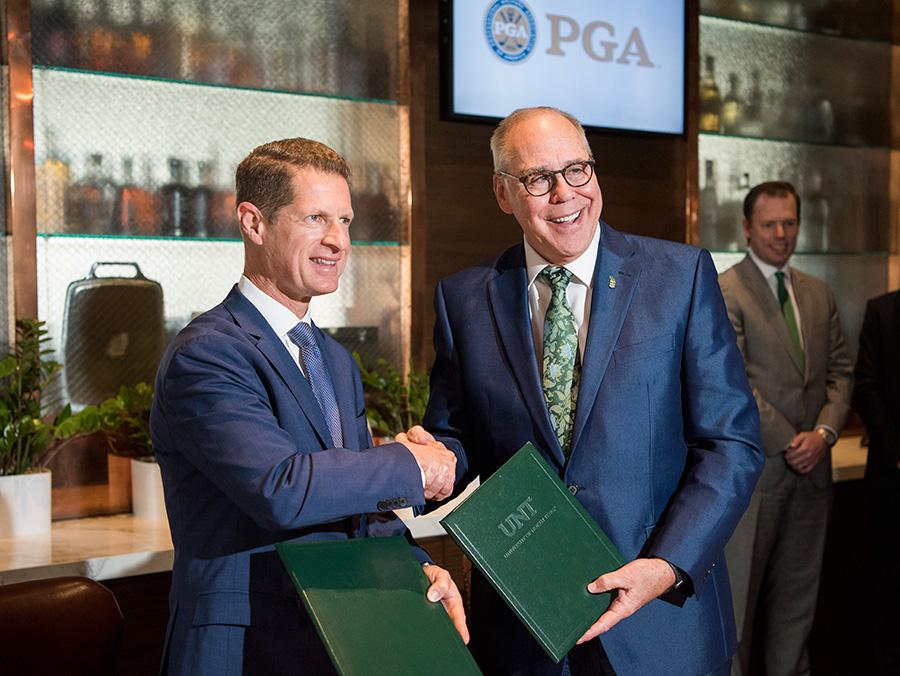 PGA Chief Operating Officer Darrell Crall and UNT President Neal Smatresk