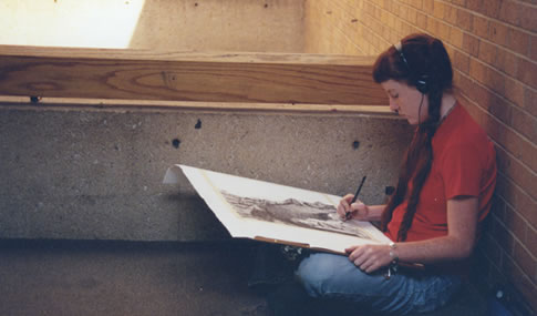 Student works on a drawing.