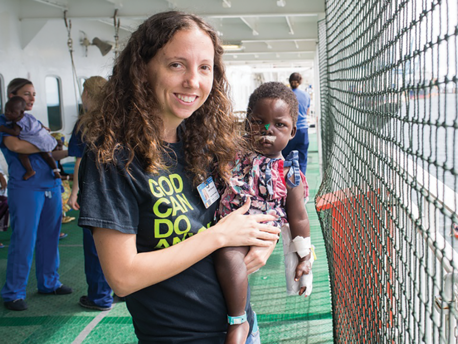 Katie Woodard holding a child