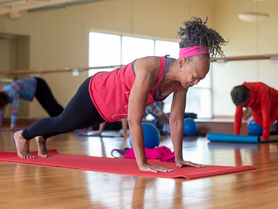 Patricia Ebaire planks during her yoga class.