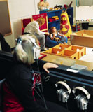 Photo of students in play therapy laboratory observing counselor with child