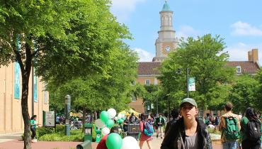 students walking in front of admin building