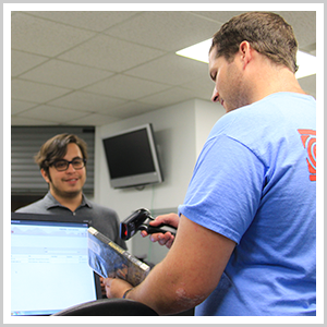 smiling man receiving a DVD