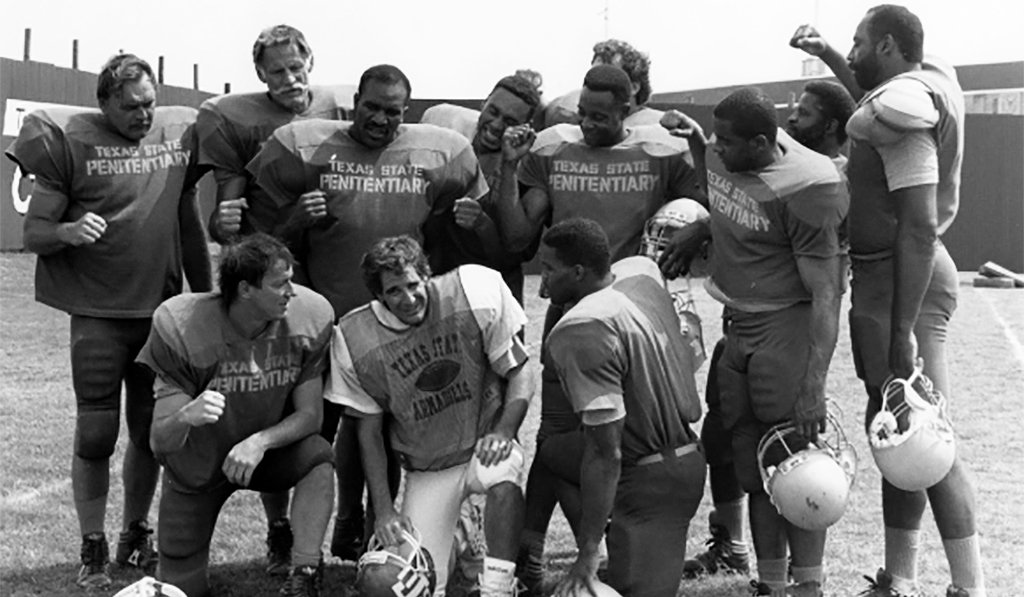 Necessary Roughness star Scott Bakula on set with athletes who made cameos, all in football uniforms -- Dick Butkus, Ben Davidson, Evander Holyfield, Roger Craig, Randy White, Jerry Rice, Tony Dorsett, Earl Campbell, Ed "Too Tall" Jones, Jim Kelly, Herschel Walker.