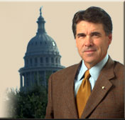 Governor Rick Perry with Texas capitol in back. Photo by Bob Daemmrich.