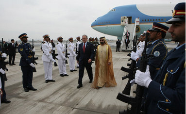 President George W. Bush walks through an honor guard with Sheikh Mohammed bin Rashid al-Maktoum, Vice President and Prime Minister of the United Arab Emirates, Monday, Jan. 14, 2008, upon arrival to Dubai. White House photo by Eric Draper