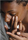 Woman preparing to put contact lens in eye