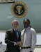 President George W. Bush presented the President’s Volunteer Service Award to Deeneaus Polk, 19, upon arrival at the airport in Gulfport, Mississippi, on Thursday, May 11, 2006.  Polk is a student and active volunteer at Mississippi Gulf Coast Community College. To thank them for making a difference in the lives of others, President Bush honors a local volunteer, called a USA Freedom Corps greeter, when he travels throughout the United States.  President Bush has met with more than 500 individuals around the country, like Polk, since March 2002.