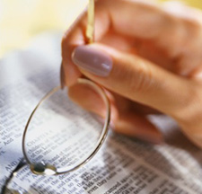 person (out of frame) reading law book