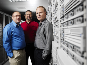 Photo of researcher in front of  EMSL Supercomputer