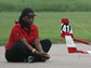 Photo of a student and a plane taking off.