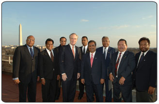 Palauan leaders meet with Secretary of the Interior Dirk Kempthorne on Feb. 25, 2008.  From left Steve McGann, Director of East Asia and Pacific, U.S. State Department; Surangel Whipps, President of the Palau Senate; Kasmir Remengesau (in back), Director of Budget; Secretary Kempthorne; Vann Isaac (in back), Office of the President; Palau President Tommy Remengesau, Jr.; Billy Kuartei, Chief of Staff, Office of the President; Hersey Kyota, Palau Ambassador to the United States; Noah Idechong, Vice Speaker of the House. Photo by Tami Heilemann. 