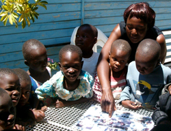 Children share stories with staff on
station days in Norton, Zimbabwe.