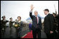 President George W. Bush waves as he and Mrs. Laura Bush arrive Monday, June 4, 2007, at Prague Ruzyne Airport in the Czech Republic where they will begin their seven-day Europe visit. White House photo by Eric Draper