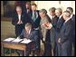 President George W. Bush signs the Chile and Singapore Free Trade Agreement Implementation Acts in the East Room Wednesday, Sept. 3, 2003.  White House photo by Tina Hager