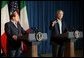 President George W. Bush welcomes Silvio Berlusconi, the Prime Minister of Italy, after his arrival at the Bush Ranch in Crawford, Texas, Sunday, July 20, 2003.  White House photo by Paul Morse