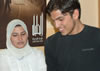 Photo of Palestinian students checking out the new library at the Global Connections Internet Learning Center in Hebron.